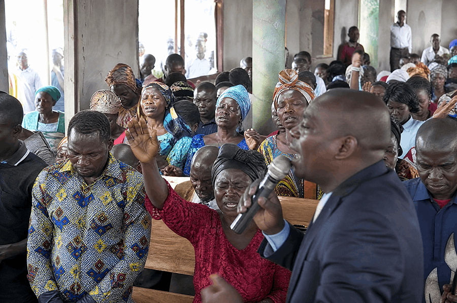 West African church congregation gathered for worship and prayer