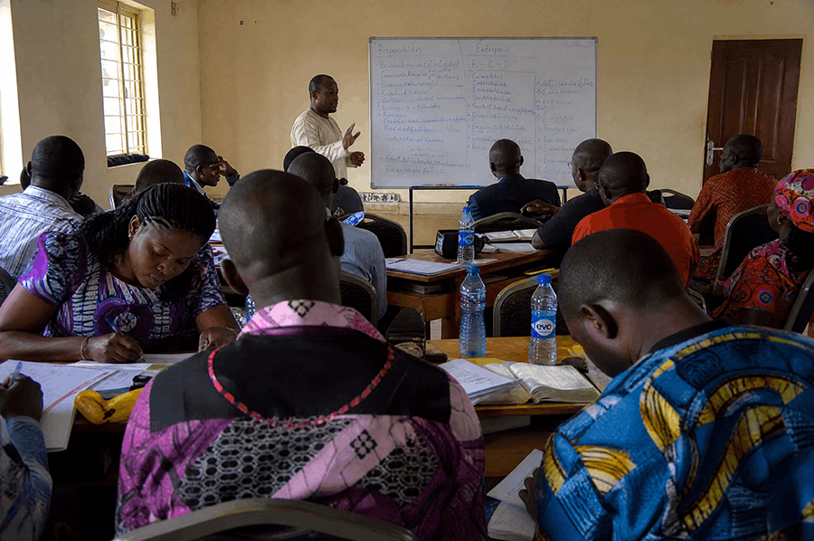 West African community members working together on a local development project